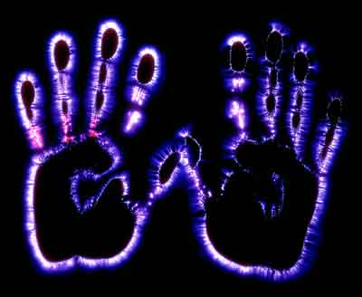 Kirlian photo of hands showing the energy field extending beyond the physical body.